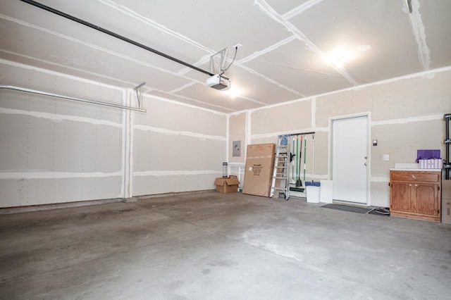 10465 172nd Ln NW, Elk River, MN 55330 - garage featuring a garage door opener and electric panel