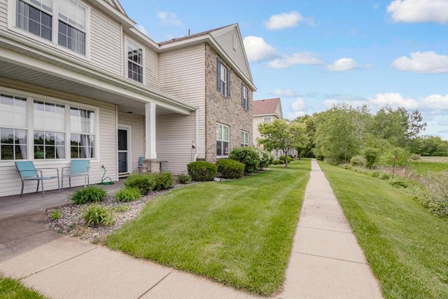 10465 172nd Ln NW, Elk River, MN 55330 - view of home's exterior featuring a yard and a patio area