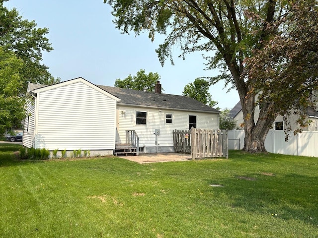 912 Arnold Ave N, Thief River Falls, MN 56701 - rear view of house with a chimney