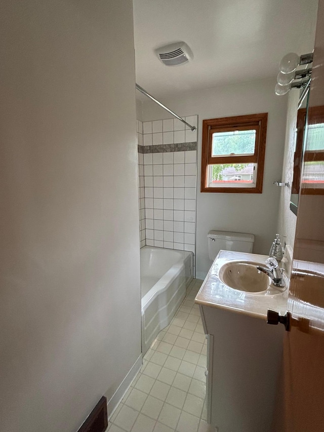 912 Arnold Ave N, Thief River Falls, MN 56701 - bathroom with tile patterned floors, vanity, shower / bathtub combination, and toilet