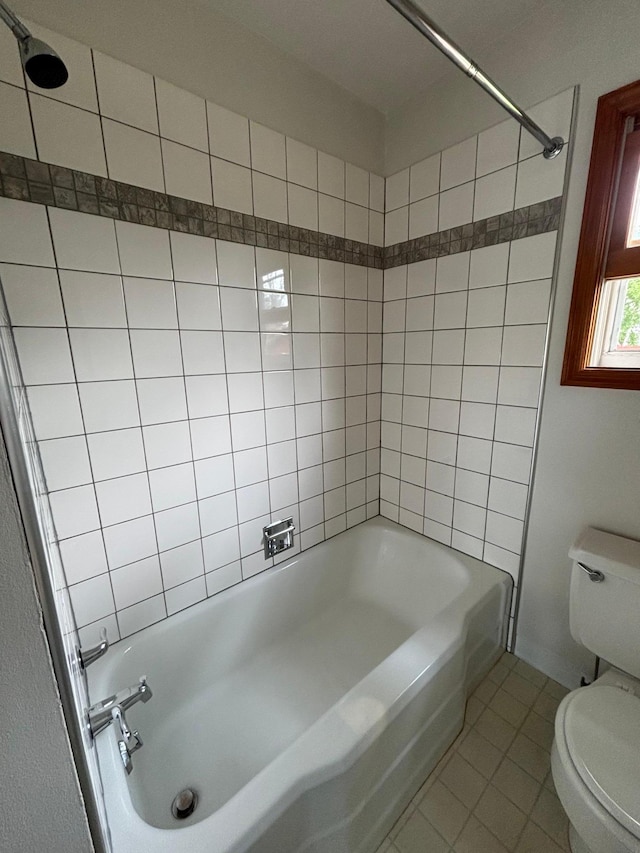912 Arnold Ave N, Thief River Falls, MN 56701 - bathroom with toilet, tile patterned floors, and shower / bathtub combination