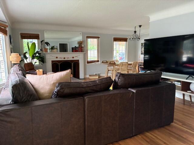 4901 Bryant Ave S, Minneapolis, MN 55419 - living room featuring a chandelier and wood finished floors