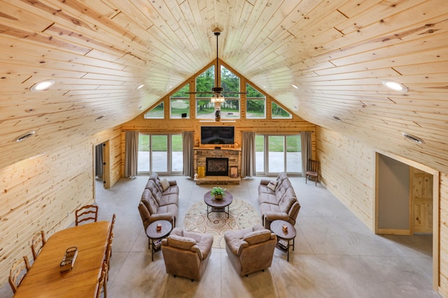 20470 220th St, Verndale, MN 56481 - living room featuring wood ceiling, wooden walls, high vaulted ceiling, plenty of natural light, and a stone fireplace