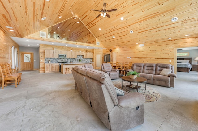 20470 220th St, Verndale, MN 56481 - living area featuring concrete floors, recessed lighting, wood ceiling, ceiling fan, and wooden walls