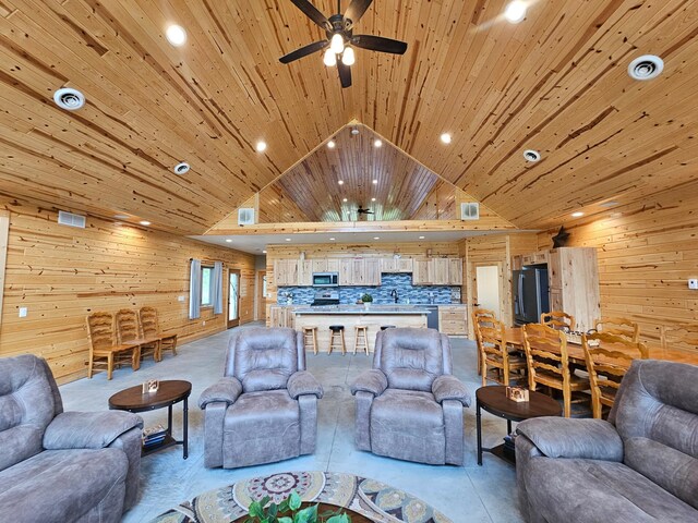 20470 220th St, Verndale, MN 56481 - living room with wood walls, recessed lighting, a ceiling fan, and lofted ceiling