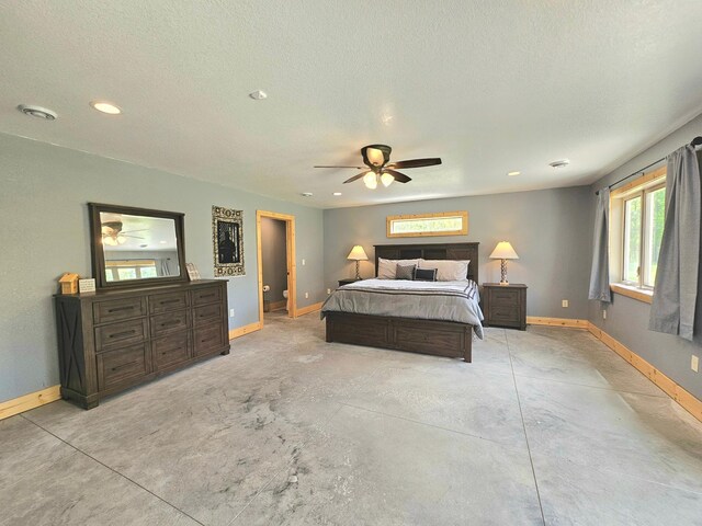 20470 220th St, Verndale, MN 56481 - bedroom featuring baseboards, concrete floors, recessed lighting, ceiling fan, and a textured ceiling