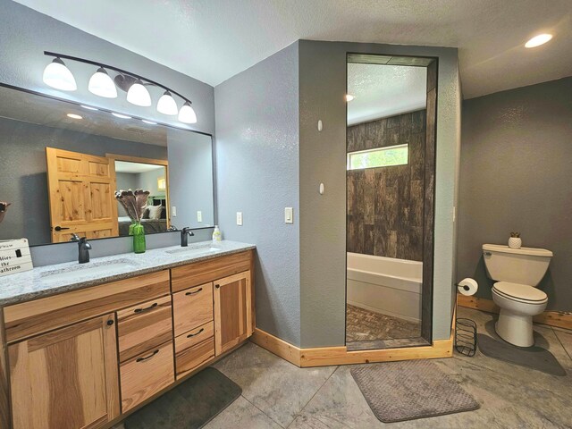 20470 220th St, Verndale, MN 56481 - bathroom with double vanity, a textured wall, baseboards, toilet, and a textured ceiling