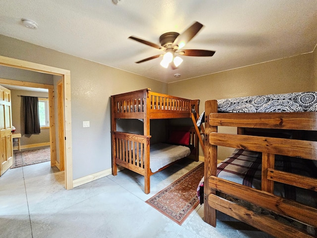 20470 220th St, Verndale, MN 56481 - bedroom with baseboards, concrete flooring, and a ceiling fan