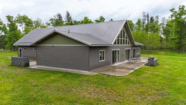20470 220th St, Verndale, MN 56481 - view of property exterior featuring a patio, a yard, and metal roof