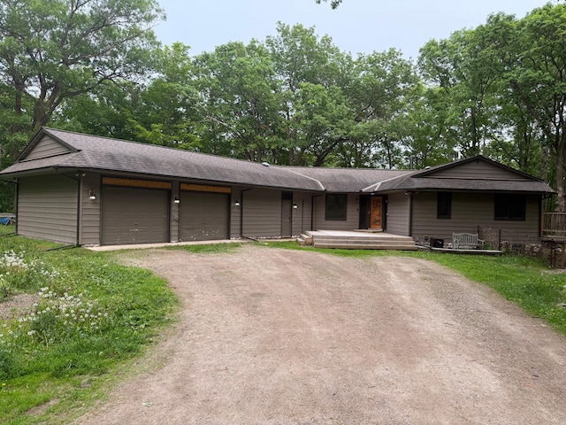 33688 416th Ave, Farm Island Twp, MN 56431 - view of front of property featuring driveway, a garage, and roof with shingles