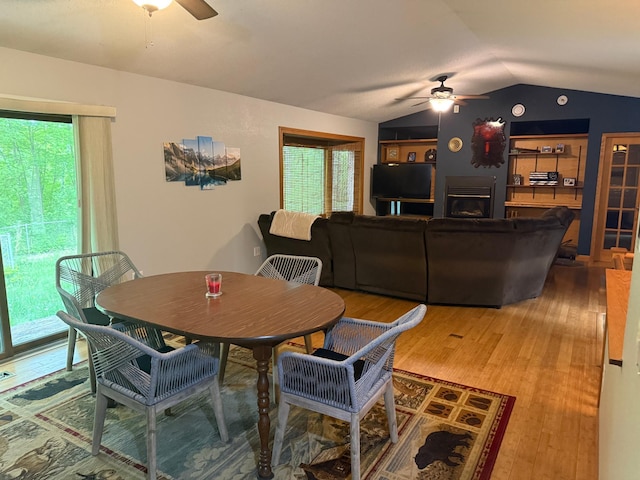 33688 416th Ave, Farm Island Twp, MN 56431 - dining space with ceiling fan, wood finished floors, vaulted ceiling, and healthy amount of natural light