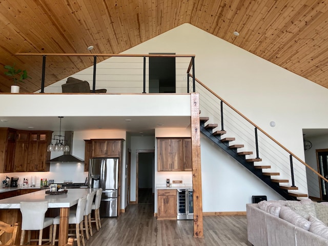 51509 County Highway 9, Scambler Twp, MN 56572 - living area with beverage cooler, high vaulted ceiling, wood finished floors, wood ceiling, and stairway