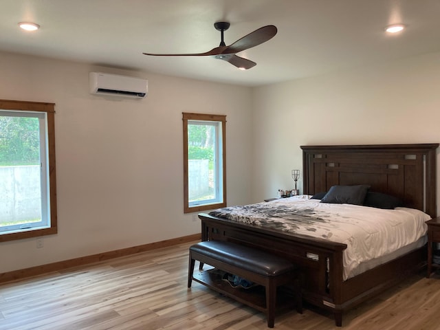 51509 County Highway 9, Scambler Twp, MN 56572 - bedroom featuring a wall mounted AC, light wood-style flooring, baseboards, a ceiling fan, and recessed lighting