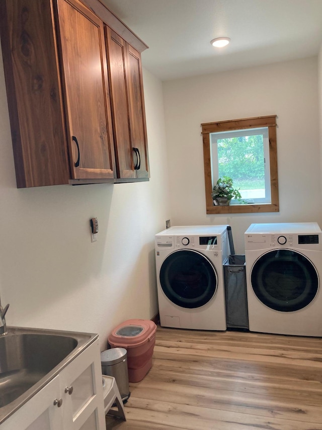 51509 County Highway 9, Scambler Twp, MN 56572 - laundry room with cabinet space, washer and dryer, and wood finished floors