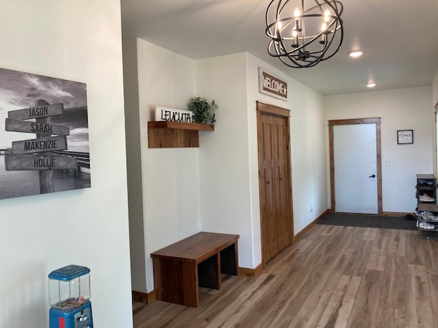 51509 County Highway 9, Scambler Twp, MN 56572 - foyer featuring wood finished floors, a chandelier, and baseboards