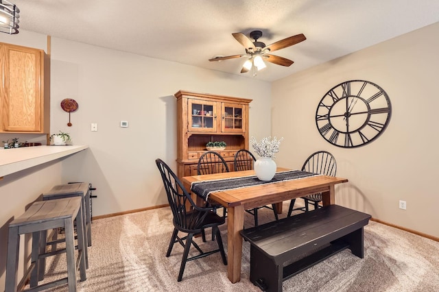 17673 96th Ave N, Maple Grove, MN 55311 - dining room featuring a ceiling fan, light colored carpet, and baseboards