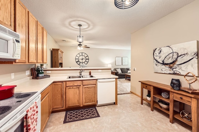 17673 96th Ave N, Maple Grove, MN 55311 - kitchen with white appliances, a sink, a peninsula, a ceiling fan, and open floor plan