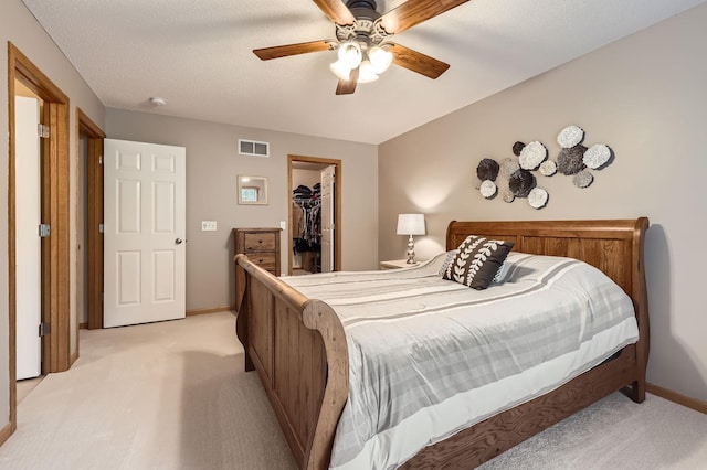 17673 96th Ave N, Maple Grove, MN 55311 - bedroom with light carpet, baseboards, ceiling fan, a walk in closet, and a closet