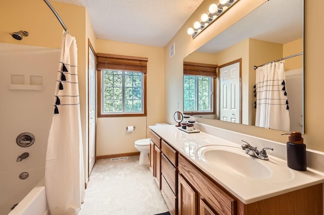 17673 96th Ave N, Maple Grove, MN 55311 - bathroom featuring healthy amount of natural light, vanity, toilet, tile patterned floors, and a textured ceiling