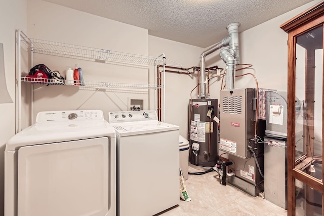 17673 96th Ave N, Maple Grove, MN 55311 - laundry area with water heater, washer and dryer, a textured ceiling, and light tile patterned flooring