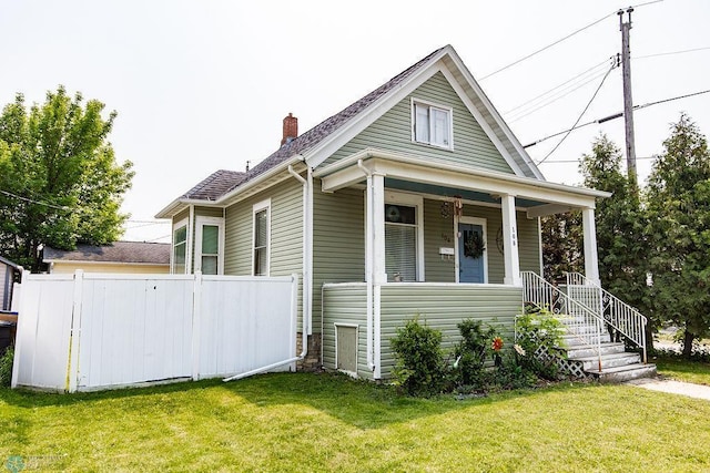 108 6th Ave N, Fargo, ND 58102 - view of front of property featuring a chimney and a porch
