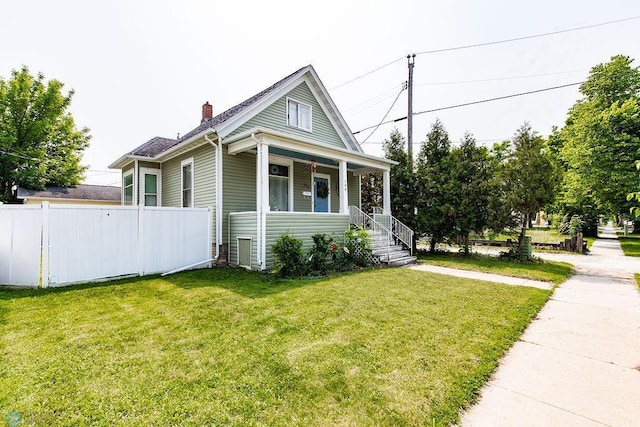 108 6th Ave N, Fargo, ND 58102 - view of front of home with a chimney and covered porch