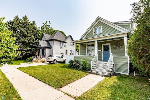 108 6th Ave N, Fargo, ND 58102 - view of front of home with a porch and a front lawn