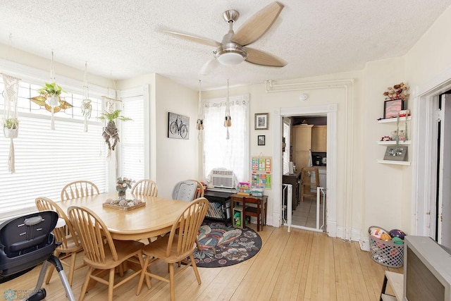 108 6th Ave N, Fargo, ND 58102 - dining space with a ceiling fan, light wood-style floors, and a textured ceiling
