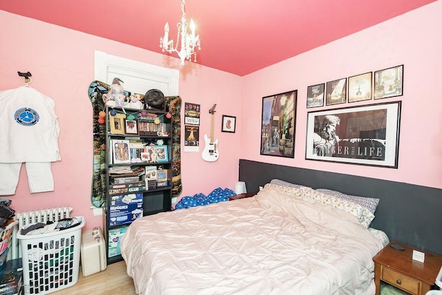 108 6th Ave N, Fargo, ND 58102 - bedroom with a chandelier and wood finished floors