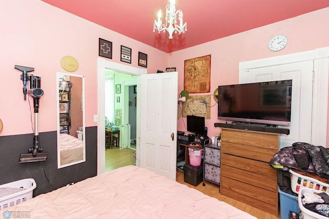 108 6th Ave N, Fargo, ND 58102 - bedroom with wood finished floors and a chandelier
