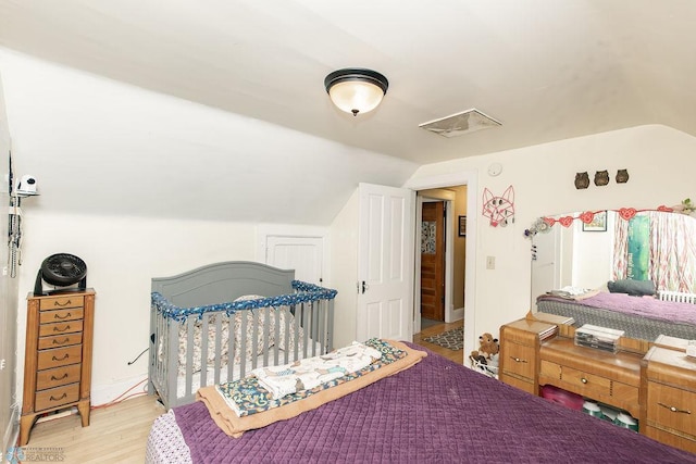 108 6th Ave N, Fargo, ND 58102 - bedroom featuring lofted ceiling and light wood finished floors