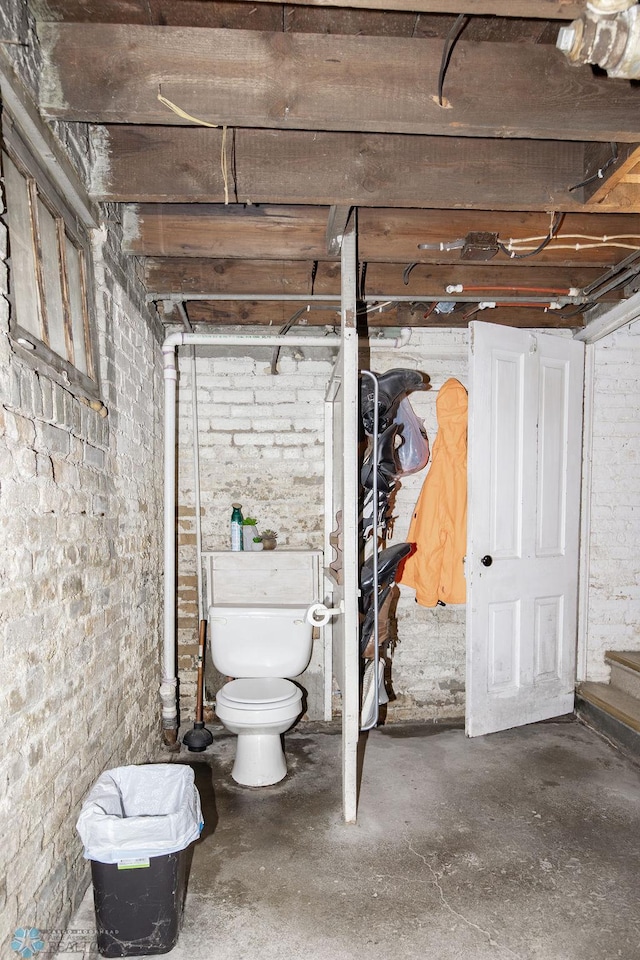 108 6th Ave N, Fargo, ND 58102 - unfinished basement featuring brick wall and stairway
