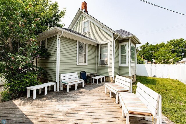 108 6th Ave N, Fargo, ND 58102 - back of property with a wooden deck, a chimney, and cooling unit