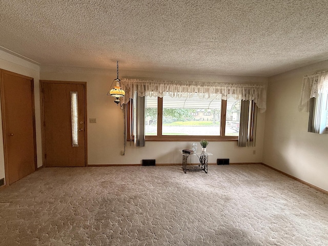 1620 4th St, Montevideo, MN 56265 - unfurnished room featuring a textured ceiling, carpet floors, and baseboards