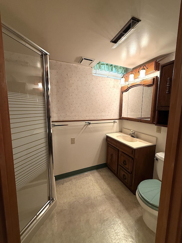 1620 4th St, Montevideo, MN 56265 - bathroom with toilet, a stall shower, vanity, wallpapered walls, and tile patterned floors