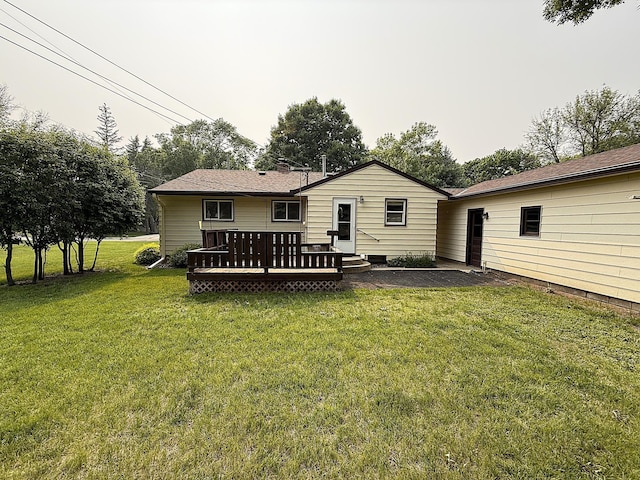 1620 4th St, Montevideo, MN 56265 - rear view of house with a deck and a lawn