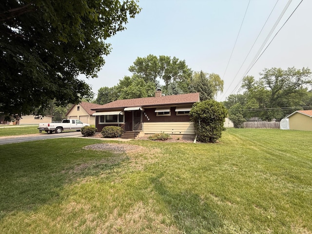 1620 4th St, Montevideo, MN 56265 - ranch-style home with a front yard, a chimney, and driveway