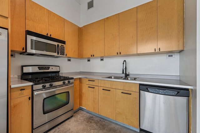 700 Washington Ave N Unit 601, Minneapolis, MN 55401 - kitchen featuring appliances with stainless steel finishes, light countertops, and concrete floors