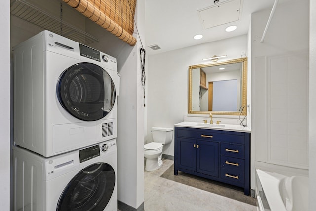 700 Washington Ave N Unit 601, Minneapolis, MN 55401 - full bathroom with estacked washer and dryer, vanity, concrete floors, a bathtub, and recessed lighting
