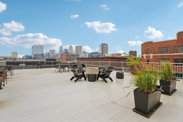 700 Washington Ave N Unit 601, Minneapolis, MN 55401 - wooden deck with a view of skyline and outdoor dining area