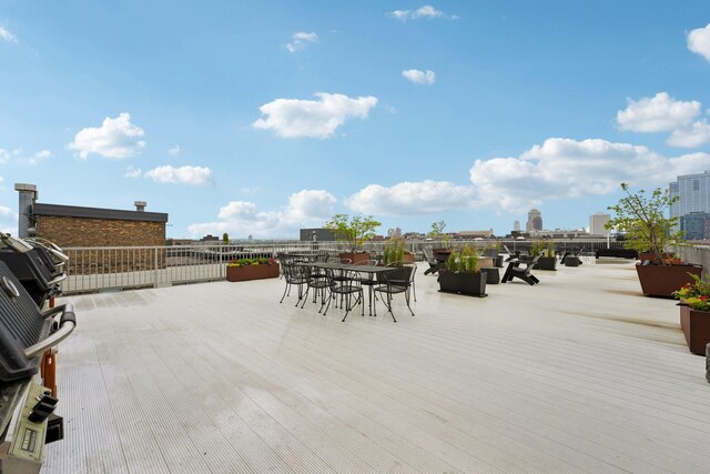 700 Washington Ave N Unit 601, Minneapolis, MN 55401 - view of patio / terrace featuring outdoor dining area and a wooden deck