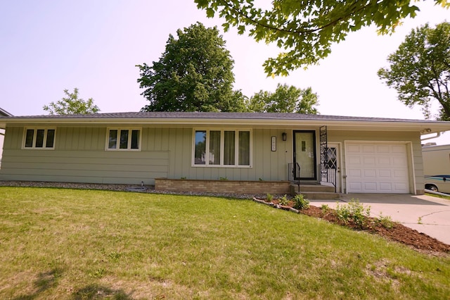 2805 12th Ave NW, Willmar, MN 56201 - single story home featuring an attached garage, concrete driveway, a front lawn, and board and batten siding