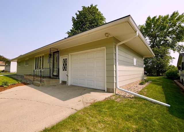 2805 12th Ave NW, Willmar, MN 56201 - view of front of house with an attached garage, driveway, and a front lawn