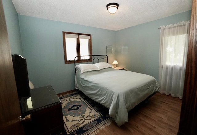 2805 12th Ave NW, Willmar, MN 56201 - bedroom with wood finished floors, baseboards, and a textured ceiling