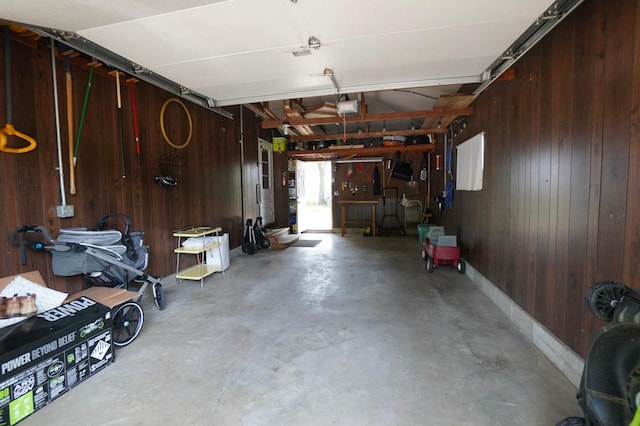 2805 12th Ave NW, Willmar, MN 56201 - garage with wood walls and a garage door opener