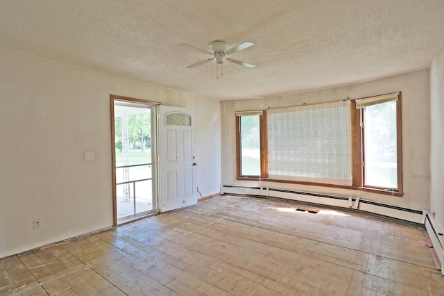 5741 Maple St, Rockford, MN 55373 - unfurnished room featuring a ceiling fan, a textured ceiling, plenty of natural light, and hardwood / wood-style floors