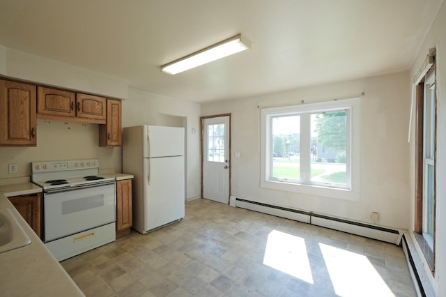 5741 Maple St, Rockford, MN 55373 - kitchen featuring white appliances, brown cabinets, baseboard heating, and light countertops