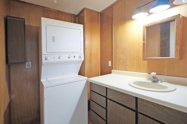 5741 Maple St, Rockford, MN 55373 - bathroom with stacked washer / drying machine and vanity
