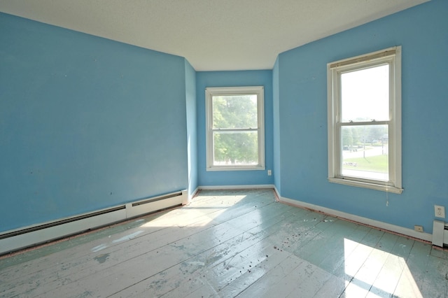 5741 Maple St, Rockford, MN 55373 - unfurnished room featuring baseboard heating and baseboards