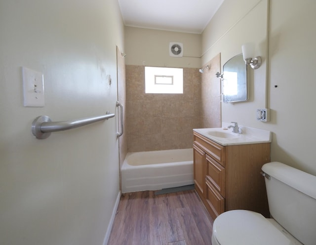 5741 Maple St, Rockford, MN 55373 - bathroom with toilet, vanity,  shower combination, and wood finished floors